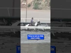 Hero on horseback rushes through floods!