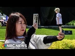 BTS fans line up to hug Jin after his discharge from the South Korean army