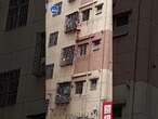 Woman climbs building wall in her slippers after locking herself out of 5th-floor apartment