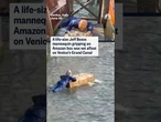 A life-size Jeff Bezos mannequin gripping an Amazon box was set afloat on Venice's Grand Canal