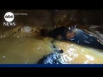Laos cave rescuers hear 'knocking' in race to find last two trapped villagers