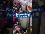 Commuters pack into train at whatever cost