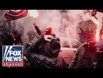 Activist SWARMED by mob SCREAMING in her face