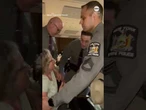 Police remove woman from rowdy GOP town hall