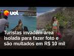 Turistas são multados em R$ 10 mil após invadirem local proibido para tirar foto em Noronha