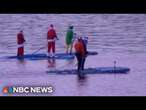 Santas trade sleighs for paddleboards to raise money for cancer