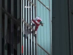 Moment French ‘Spiderman’ free climber scales a skyscraper with bare hands