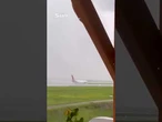 Terrifying moment plane lands on single wheel in severe storm #plane #weather #storm