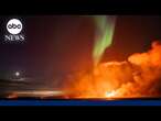 Northern Lights shine as lava spews from erupting volcano in Iceland