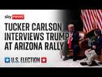 Donald Trump speaks at an event in Arizona with Tucker Carlson and Robert F. Kennedy Jr