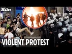 Demonstrators hurl flares at riot police as 140,000 Serbians hit streets to demand snap election