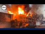 Homes still bursting into flames in LA days after the initial fire passed through