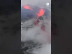 Lava flows against rainy backdrop in Iceland