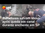 Moradores salvam idoso após queda em canal durante enchente em Santos; veja vídeo