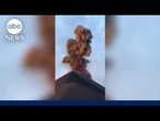Tourists flee erupting volcano