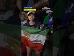 Protesters gather outside Iran's first World Cup match