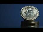 Bitcoin ultrapassa os U$ 60,000 e se aproxima de recorde | AFP