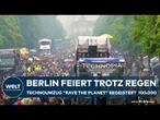 BERLIN: Tanzend durch den Regen - Rund 100.000 feiern beim Technoumzug "Rave the Planet"