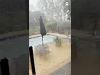 Huge hail pounds backyard pool in Australia