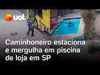 Calor faz homem estacionar caminhão e pular em piscina de loja com roupa em SP; veja vídeo