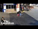 Surveillance footage shows Ice agents pushing 79-year-old man to the ground
