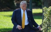 Trump llega a Pekín para su cumbre de dos días que le llevará a reunirse con Xi