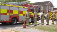 Bicester firefighters give guard of honour to colleagues