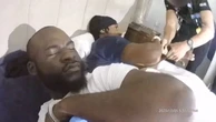 Moment police handcuff bleary-eyed drug dealers sleeping in bed