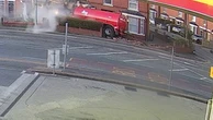 Moment tractor smashes into homes after drug driver runs red light