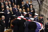 Bush pats Obama’s belly as he takes seat at Jimmy Carter funeral