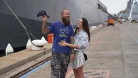 Rower trapped for three days in Cyclone Alfred reunited with wife
