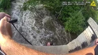 Terrifying moment person is swept down river after going to rescue dog