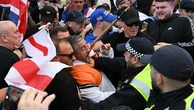 Police clash with anti-migrant protesters marching on Epping council