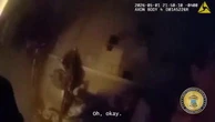 Police officer kicks down burning door to rescue mother and children