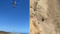 Kite surfer rescued from beach after spelling message with rocks