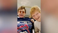 Ed Sheeran and Elton John swap Christmas presents at football match
