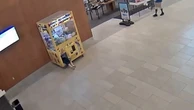 Child crawls into claw machine and gets stuck