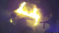 Good Samaritans and cops rescue of woman from burning car