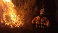 Firefighters come dangerously close to wildfires tearing through Spain