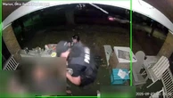 Moment police officers get caught in the middle of a drive-by shooting