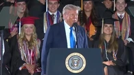 Trump impersonates trans weightlifter at Alabama graduation speech