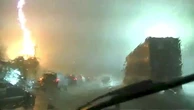 Dash cam footage captures pillar of fire sparked by lightning strike