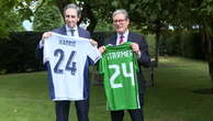 Keir Starmer and Simon Harris trade names on football shirts