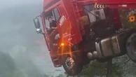 Lorry driver left dangling over edge of 700ft collapsed bridge