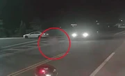 Car misses child by inches as it illegally passes parked school bus