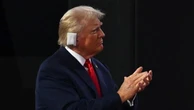 Trump appears emotional as he enters RNC with bandaged ear