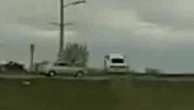 Wild moment car flies over another vehicle while fleeing police