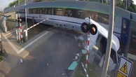 Train slams into van at level crossing after driver runs red light