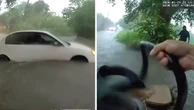 Baby rescued from car trapped in rising flood waters