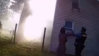 Video: Police catch child jumping from window of burning house
